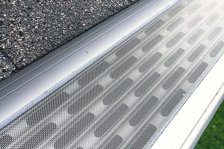 Micro-mesh gutter guards installed over gutters on an Indianapolis roofline